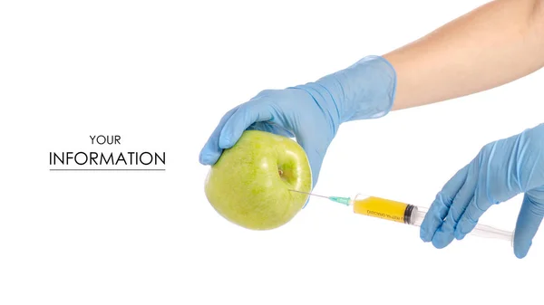 In de handen van een apple-patroon syringe — Stockfoto