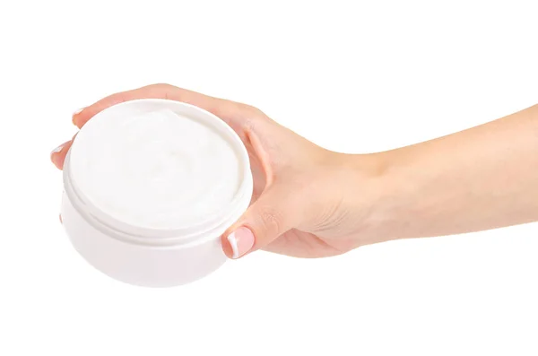 Vaso bianco di crema per un corpo in mani — Foto Stock