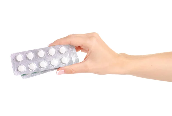 Pílulas de medicamentos em blister, comprimidos de medicamentos na mão isolados em fundo branco — Fotografia de Stock