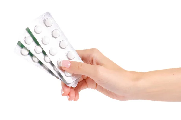 Médicaments en plaquettes thermoformées, comprimés médicamenteux à la main isolés sur fond blanc — Photo