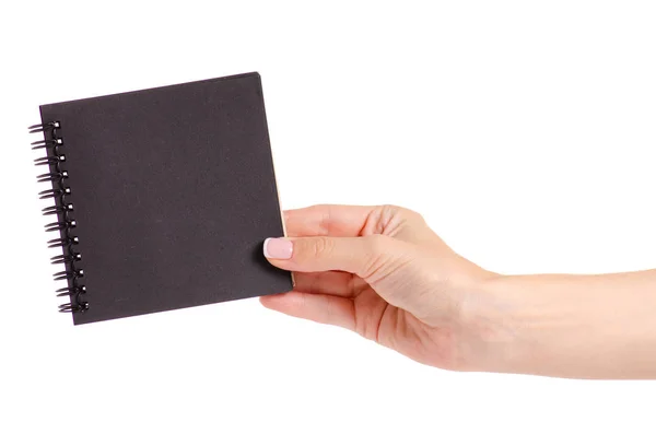 Notizblock mit schwarzem Papier in der Hand — Stockfoto