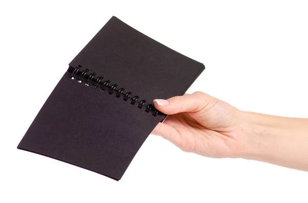 Notepad with black paper in hand — Stock Photo, Image