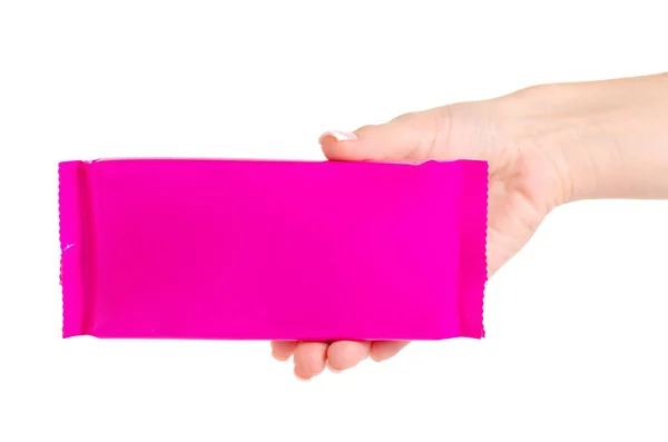 Pinkfarbene Schokoladenverpackung in der Hand — Stockfoto