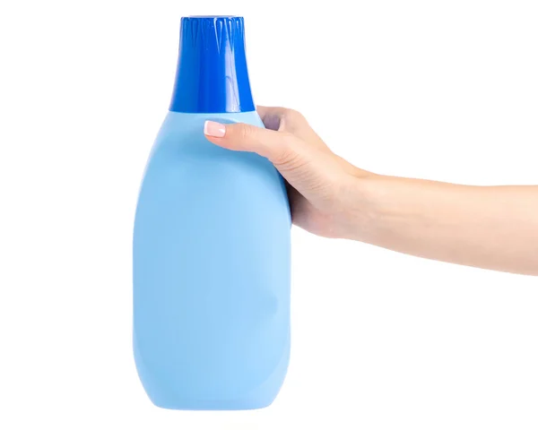 Botella con el acondicionador para ropa de lino en la mano — Foto de Stock