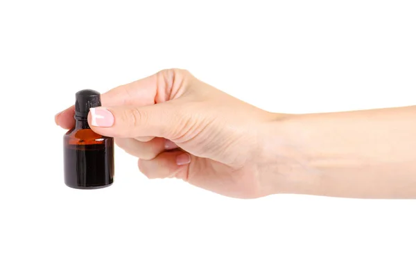 Лекарственная бутылка йода в руке — стоковое фото
