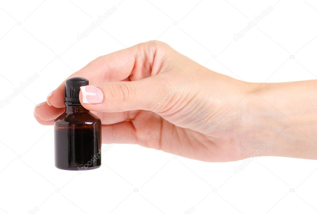 Bottle of medicine Iodine in the hand