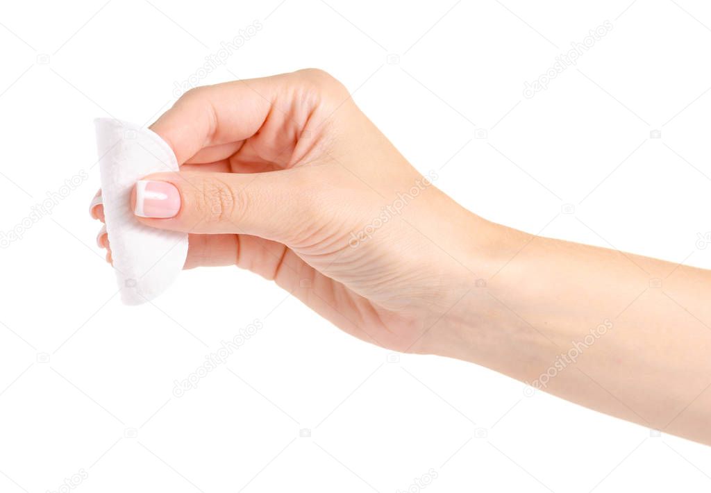 Wadded cotton pads in a hand