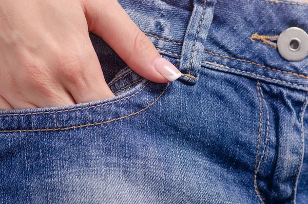 Woman in jeans pocket macro