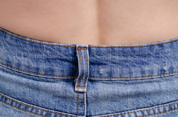 Женщина в джинсовом макро — стоковое фото