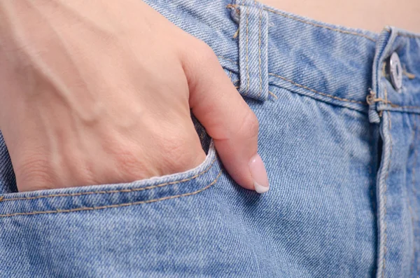 Woman in jeans pocket macro