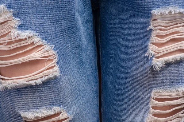 Woman in torn jeans macro — Stock Photo, Image