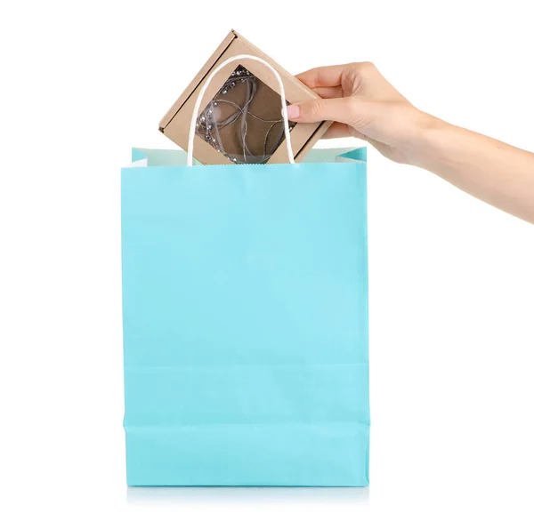 Box with jewelery decoration paper bag in hand — Stock Photo, Image