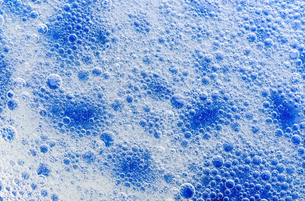 Water detergent bubbles foam blue macro — Stock Photo, Image