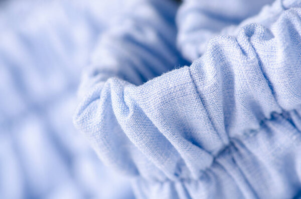 Blue fabric linen clothing seams rubber band