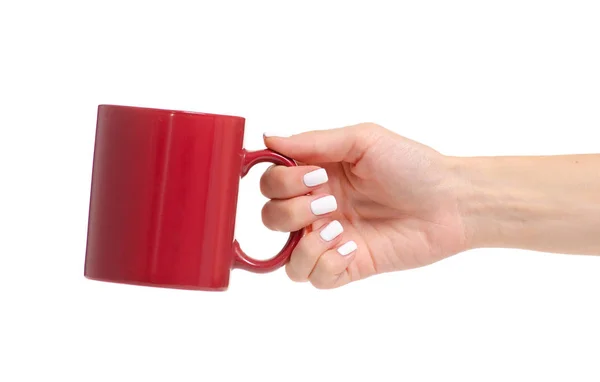 Red mug cup in hand — Stock Photo, Image