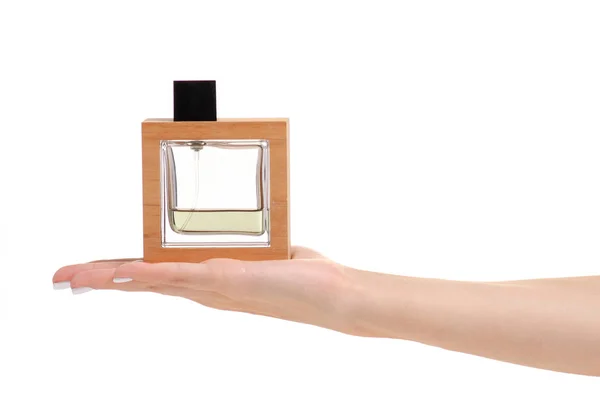 Parfum fles in de hand — Stockfoto