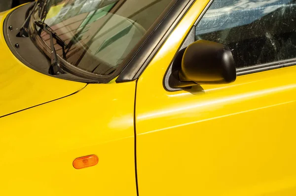 Yellow car mirror