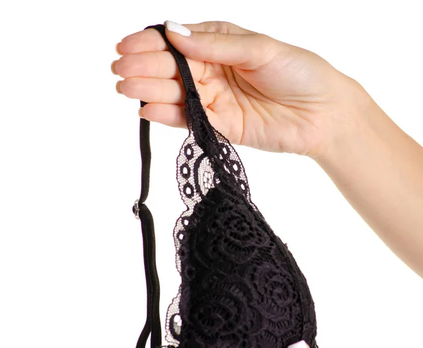 Il pizzo nero pizzo reggiseno in mano — Foto Stock