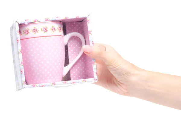 Taza taza vintage rosa caja de flores en la mano — Foto de Stock