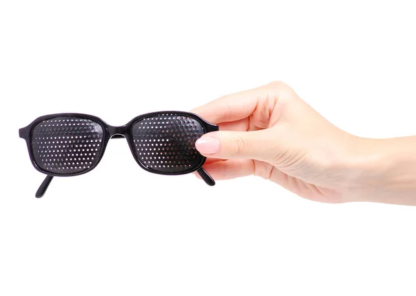Děrované brýle lékařské v ruce — Stock fotografie