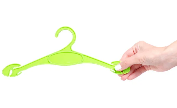 Grön plast hängare i hand — Stockfoto