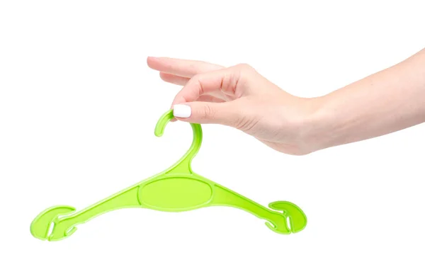 Grön plast hängare i hand — Stockfoto