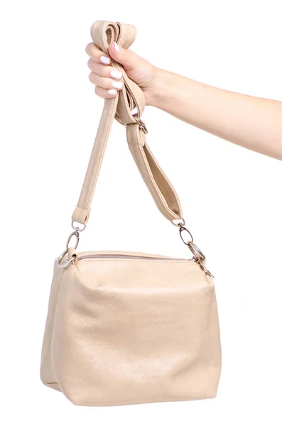 Female beige leather bag in hand — Stock Photo, Image