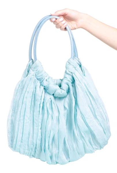 Weibliche blaue Tasche in der Hand — Stockfoto