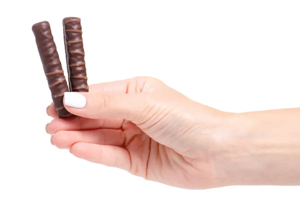 Chocolate candy sticks in a hand — Stock Photo, Image