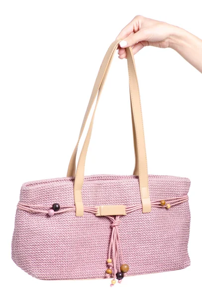 Bolsa rosa feminina na mão — Fotografia de Stock