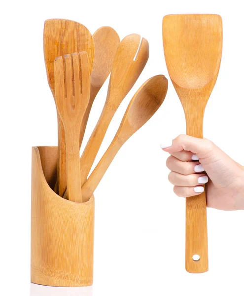 Wooden kitchen tools in a hand — Stock Photo, Image