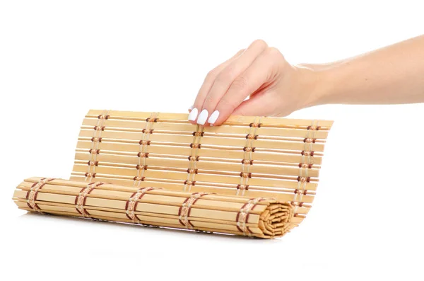 Tappeto di bambù naturale in mano — Foto Stock