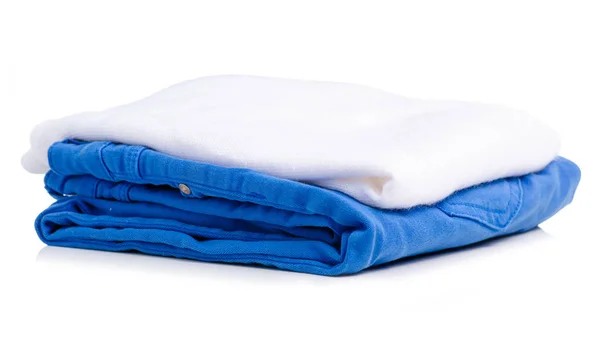 Stack of clothing blue jeans and white sweater — Stock Photo, Image