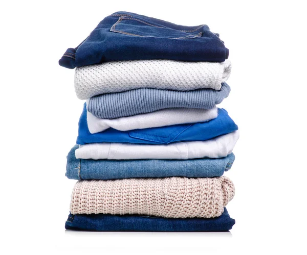 Stack of clothing jeans sweaters — Stock Photo, Image