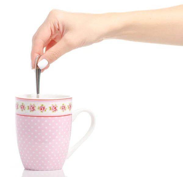Uma caneca de xícara de colher de chá na mão — Fotografia de Stock