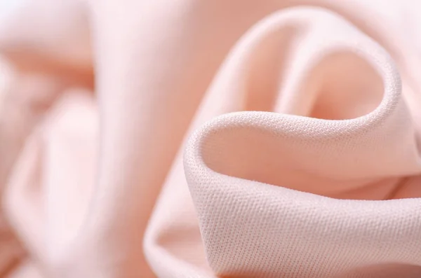 Tela rosa melocotón textura material textil macro — Foto de Stock