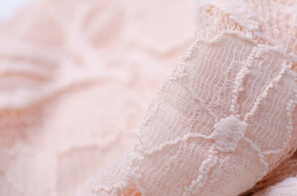Pêssego tecido rosa matéria têxtil textura openwork malha macro — Fotografia de Stock