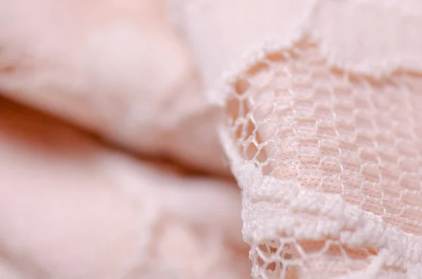 Pêssego tecido rosa matéria têxtil textura openwork malha macro — Fotografia de Stock