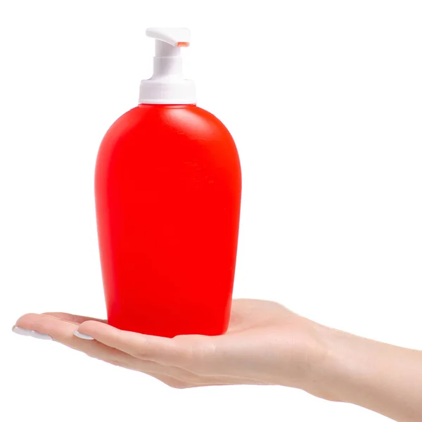 Red bottle with soap dispenser in hand — Stock Photo, Image