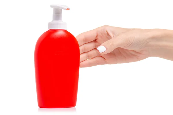 Червона пляшка з мильним дозатором в руці — стокове фото