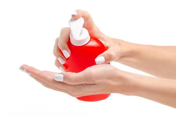 Röd flaska med tvålpump i hand — Stockfoto