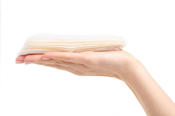 Pastiglie sanitarie mestruazioni bianche in mano — Foto Stock