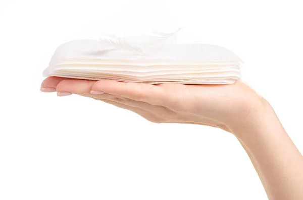 Sanitary pads menstruation white feather in hand — Stock Photo, Image