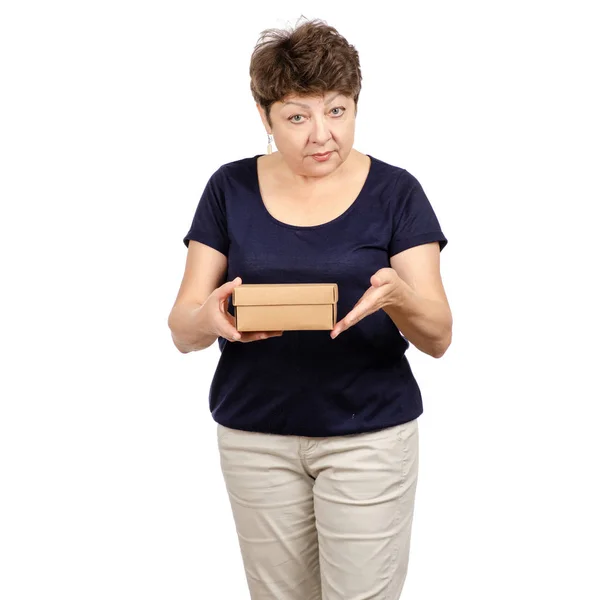 Beautiful woman aged is holding a box — Stock Photo, Image