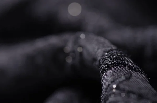 Zwarte stof textuur materiaal sparkles pailletten glans — Stockfoto