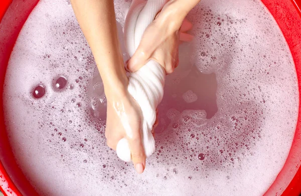 Women washing white sweater clothes in basin enemale powdered detergent — Stock Photo, Image