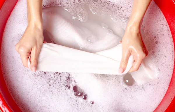 Women washing white sweater clothes in basin enemale powdered detergent — Stock Photo, Image