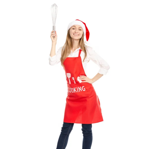 Kırmızı önlük Noel Baba şapkası bir mutfak çırpma teli corolla elinde bir kadında — Stok fotoğraf