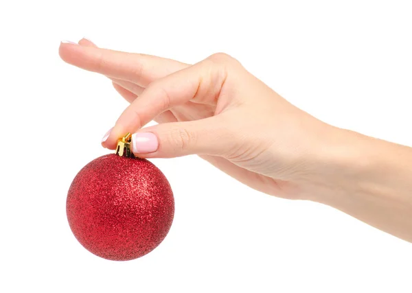 Χριστούγεννα παιχνίδια κόκκινη μπάλα στο χέρι — Φωτογραφία Αρχείου