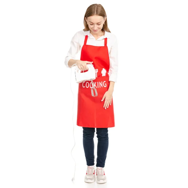 Bir kadın bir mutfak Mikser elinde kırmızı bir önlük — Stok fotoğraf